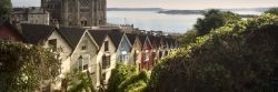 St Colmans Cathedral in Cobh with colourful houses.