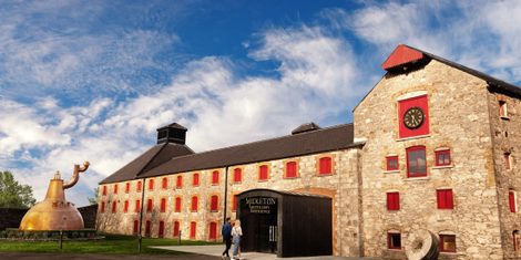 The entrance to the Old Midleton Distillery, County Cork, with its copper pot still and arched gateway