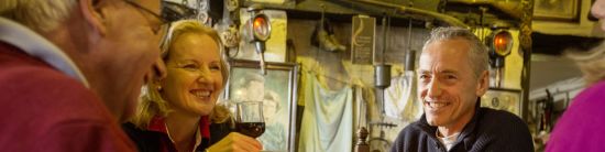 Tourists drinking in a pub on one of our Ireland Tours