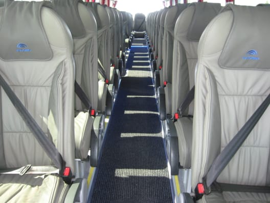 The interior of a 51 Seater full sized Coach looking aft down the aisle