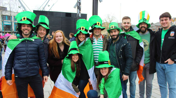 People celebrating a St Patrick's Day parade in Cork City, Ireland