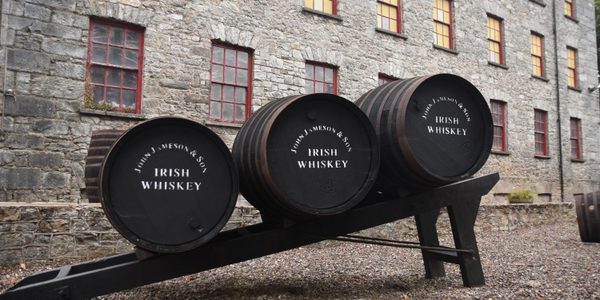 Three John Jameson & Son Irish Whiskey casks outside the historic distillery buildings at Midleton, County Cork