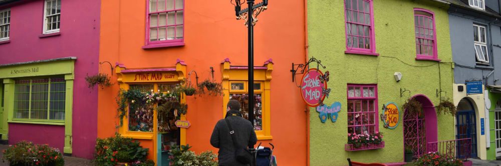 Man admiring the colourful buildings of Kinsale