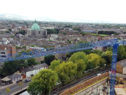 Skyline of Dublin City with a crane in the foreground