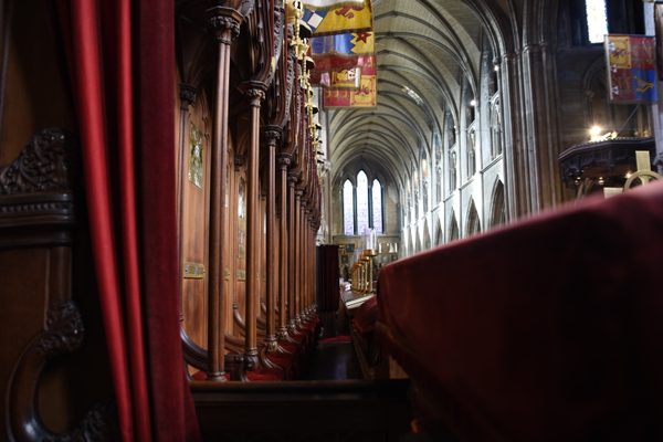 The dark wooden choir stalls