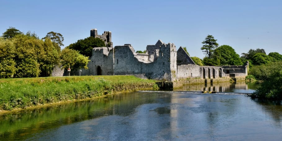 Desmond Castle on the banks of the River Maigue on the edge of Adare village