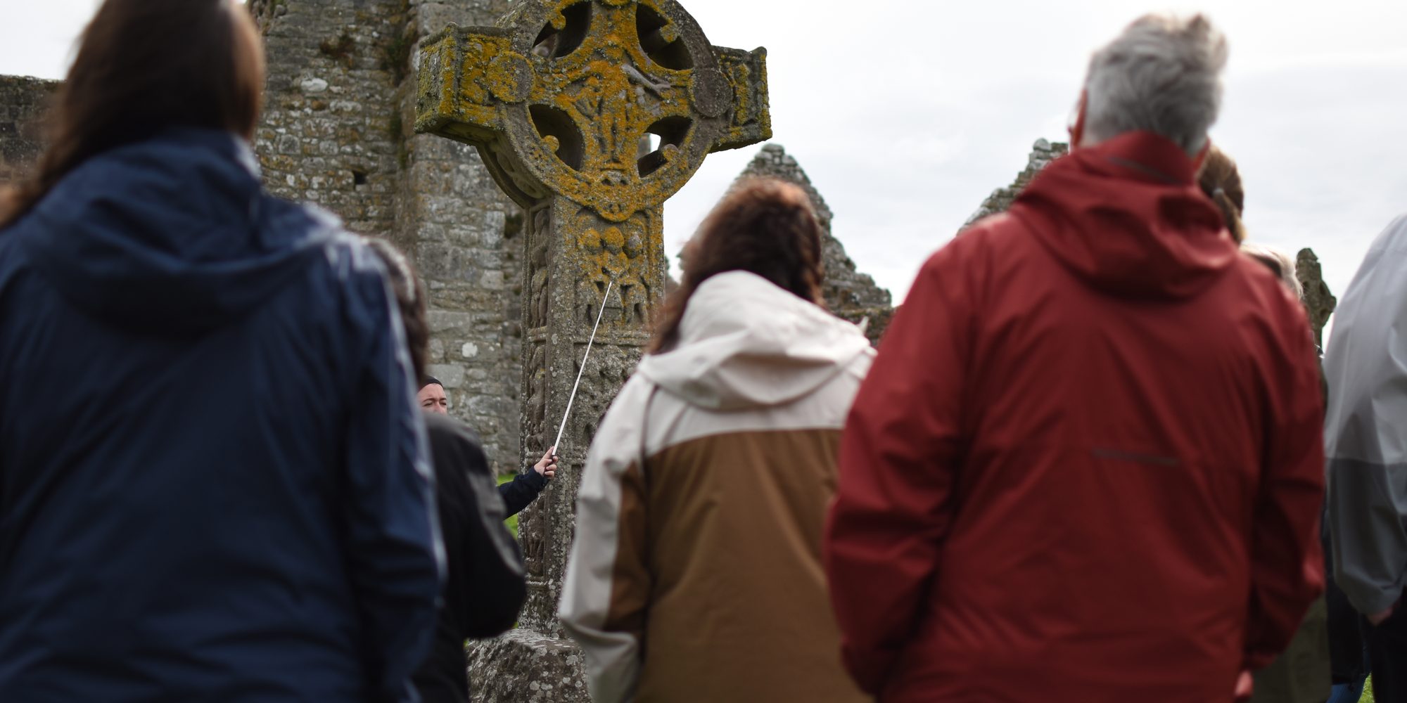 A tour group at the ancient high crosses of Clonmacnoise
